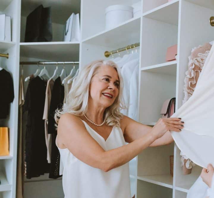 Woman looking at clothes in good condition 
