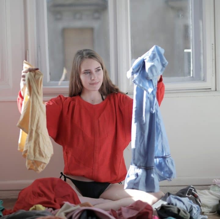 Woman holding clean clothing