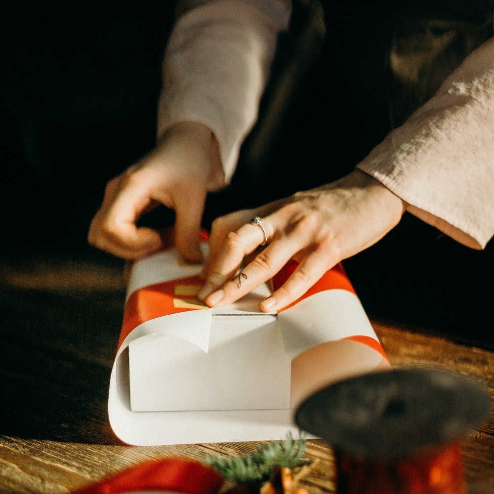 Use large bins as gift wrapping storage